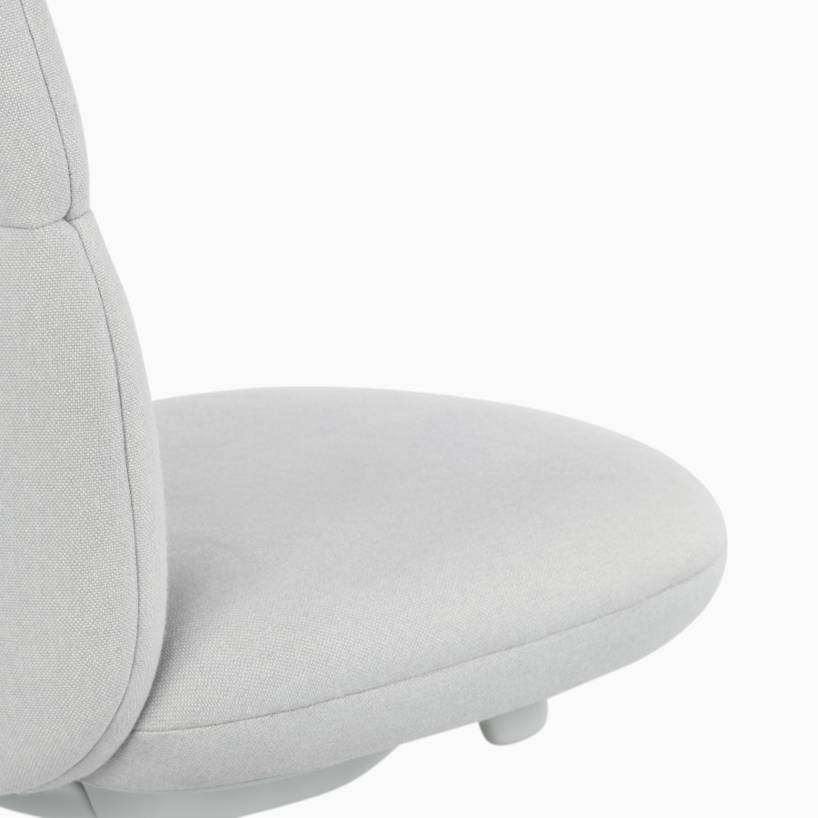 Detail view of an Asari chair by Herman Miller in light grey without arms.