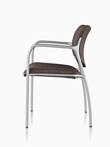 Profile view of a brown Aside Chair with silver arms.