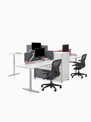 Three height-adjustable workstations designed for collaboration. Select to go to the Atlas Office Landscape product page.
