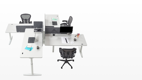Overhead view of a zigzag configuration of height-adjustable Atlas Office Landscape desks with black Aeron office chairs. Overhead view of a zigzag configuration of height-adjustable Atlas Office Landscape desks with black Aeron office chairs.