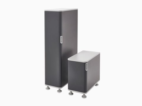 Two Atlas Storage units in black with white tops.