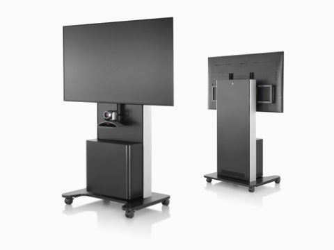 Two black AV/VC One technology carts with large digital displays and webcams, one facing forward and the other facing backward. Two black AV/VC One technology carts with large digital displays and webcams, one facing forward and the other facing backward.
