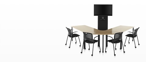 Black Caper office chairs around a u-shaped wood top table facing a black AV/VC One cart with large digital display and webcam. Black Caper office chairs around a u-shaped wood top table facing a black AV/VC One cart with large digital display and webcam.