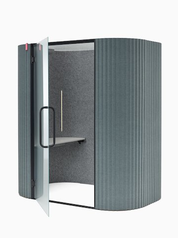 An angle view of a Bay Work Pod Pro with the door ajar and the occupancy sensor lit.