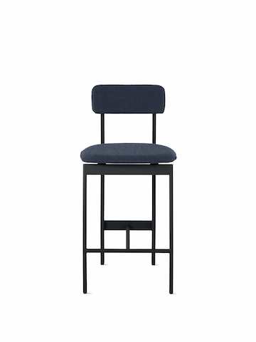 A counter height Betwixt Stool with navy blue fabric and a black frame.