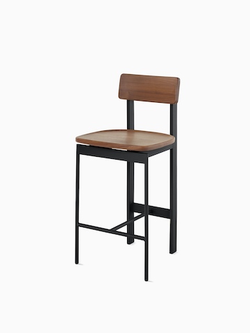 A walnut counter height Betwixt Stool with a black frame.
