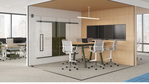 Boa Table in enclosed meeting space with teardrop, standing height table with white flat oak top and olive base.
