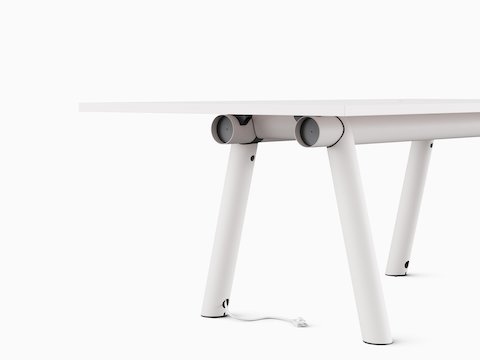 Cable management on white Boa Table.