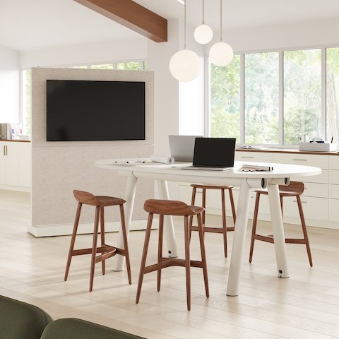 Oval top Boa Table in a huddle studio space setting, counter height with stools and OE1 Agile media wall.