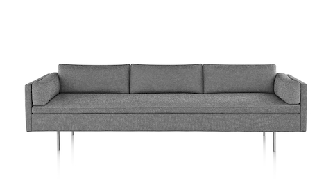 Bolster Sofa with heathered grey upholstery and satin chrome base, viewed from the front. Bolster Sofa with heathered grey upholstery and satin chrome base, viewed from the front.