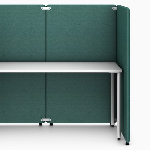 Four green Bound Freestanding Screens in a booth configuration around a white OE1 Rectangular Table, viewed from the front.