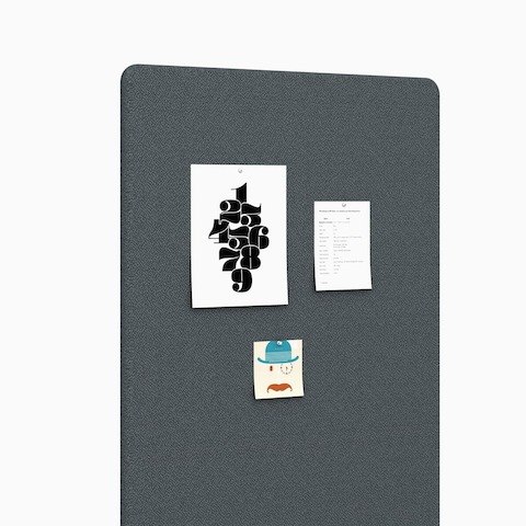 Detail of a dark gray Bound Mobile Screen with materials tacked up, viewed from an angle.