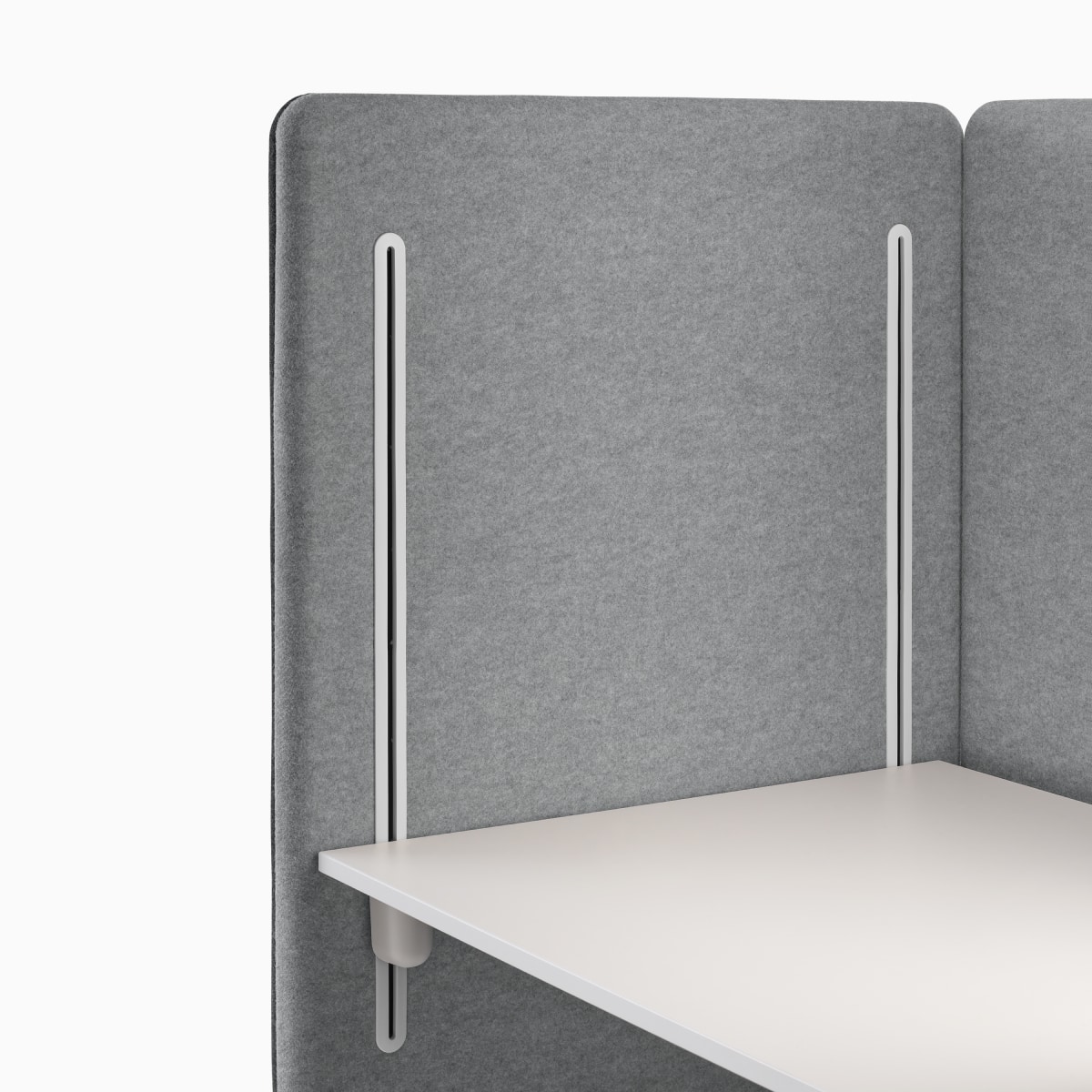 Detail of grey interior panel with desk glides and white worksurface on Bound Sit-Stand Desking.