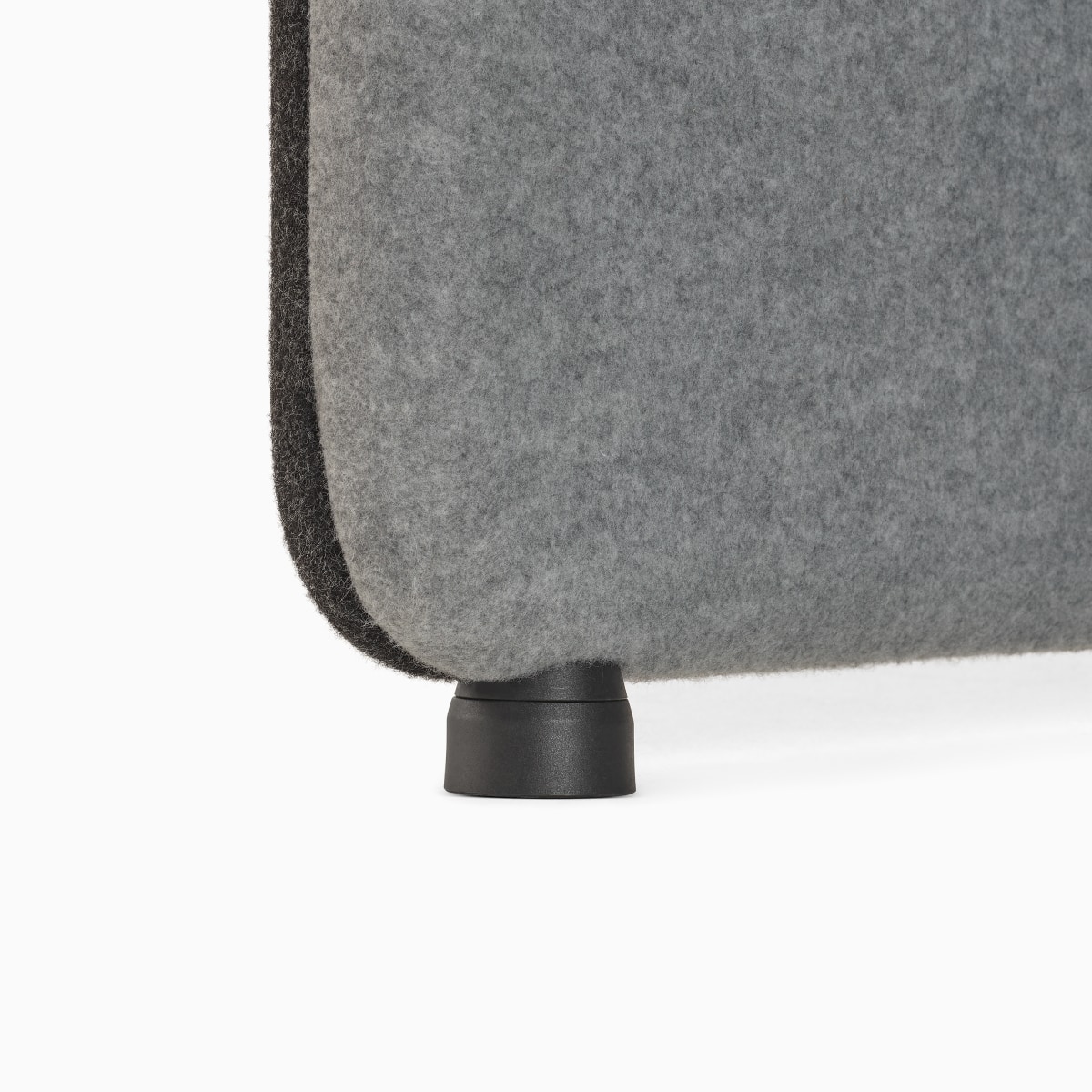 Detail of black foot attached to light grey gallery panel on Bound Sit-Stand Desking
