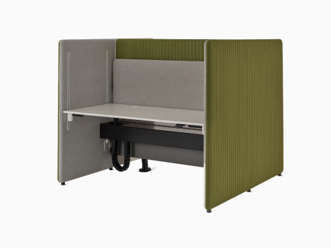 Angled view of green and grey Bound Sit-Stand Desking where both desk attached screens are in seated position.