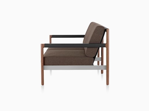 A gray Brabo lounge chair with wood legs and black arms, viewed from the front.