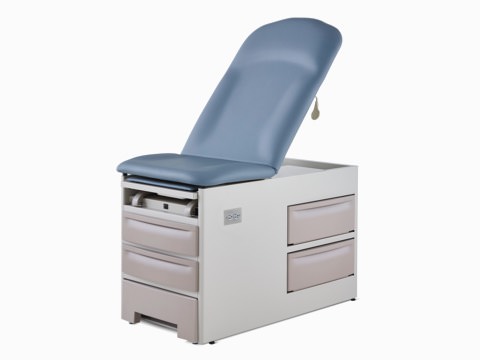 Three-quarter, left view of an exam table with a blue upholstered back and seat with a taupe metal base.