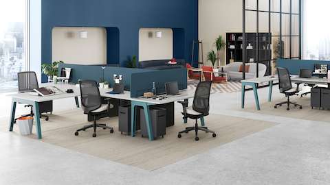 Byne System featuring the supervisor-plus end extension with Optimis legs, accompanied by ergonomic Verus Chairs.