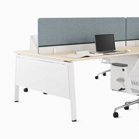 A detailed shot of a Byne System bench with Imagine legs and gray screens. A detailed shot of a Byne System bench with Imagine legs and gray screens.