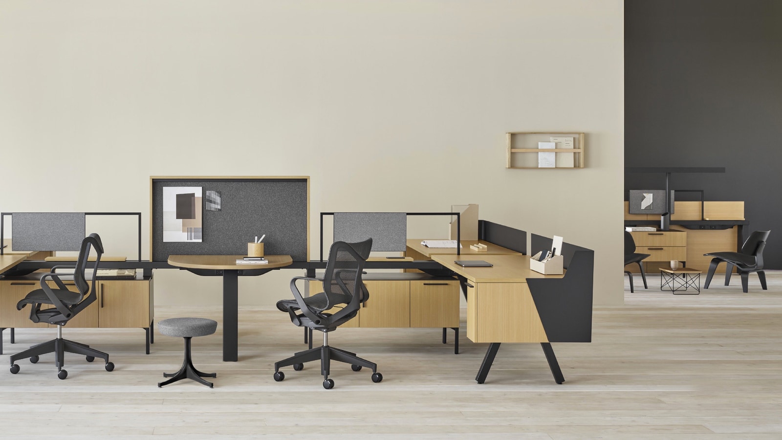 A collaborative setting with a Canvas Group display wall and standing height surface, tackable screens, writable screens, and light gray Lino office stools. Select to go to the Collaborative Workspaces page within the Canvas Lookbook.