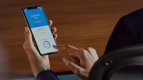 Photo of a person interacting with the Live Platform app on a smart phone.