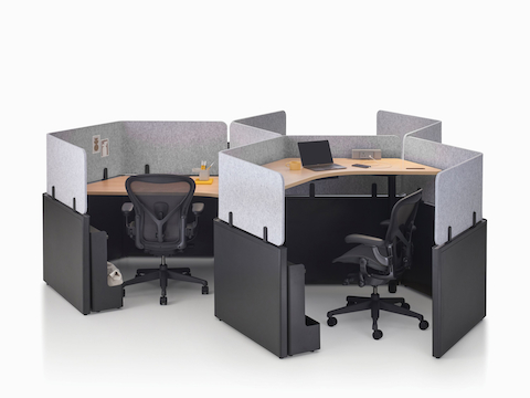 A group of Catena Office Landscape workstations in a honeycomb configuration with black Aeron Chairs.