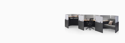 Three Catena Office Landscape workstations in a linear honeycomb configuration and light gray screens.