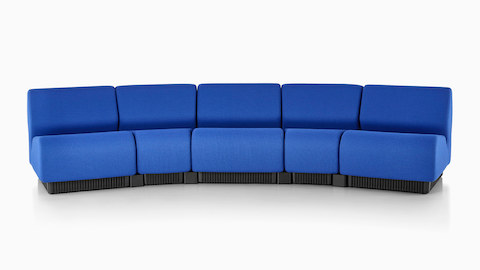 Five blue Chadwick Modular Seating modules arranged to form a gentle curve.