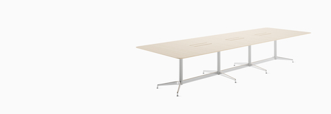 A large rectangular Civic Table with three cutouts in the surface to access power and data.