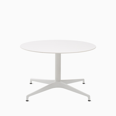 A round white Civic Table at lounge height.