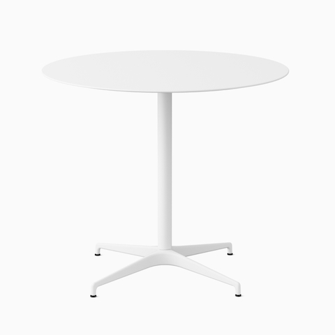 A round white Civic Table at standing height.