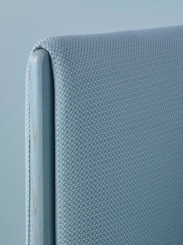 Close view of a patterned blue fabric on a ColourForm seating piece.