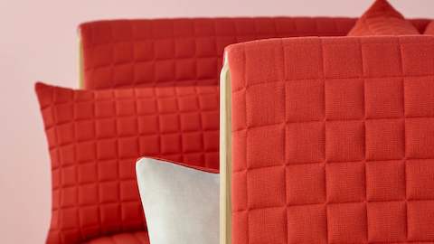 Close view of a red fabric on a ColourForm seating piece. 