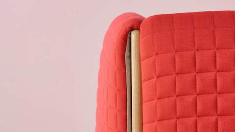 Close view of a red fabric on a ColourForm seating piece. 