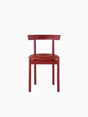 A red Comma Chair with a seat pad, viewed from the front.