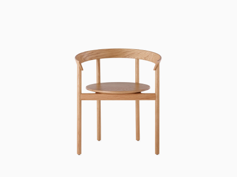 An oak Comma Chair with arms, viewed from the front. An oak Comma Chair with arms, viewed from the front.