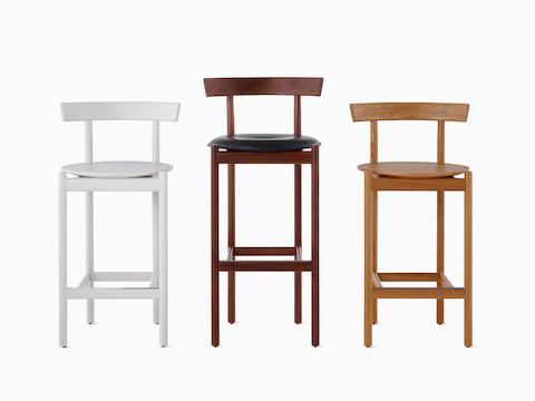 Two counter-height and a bar-height Comma Stool.
