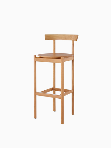 An oak bar-height Comma Stool. Select to go to the Comma Stool product page.
