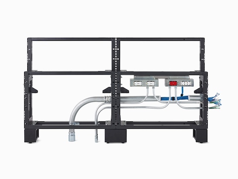 A close-up view of Commend Nurses Station's internal frame with power and data cords routing throughout the structure.