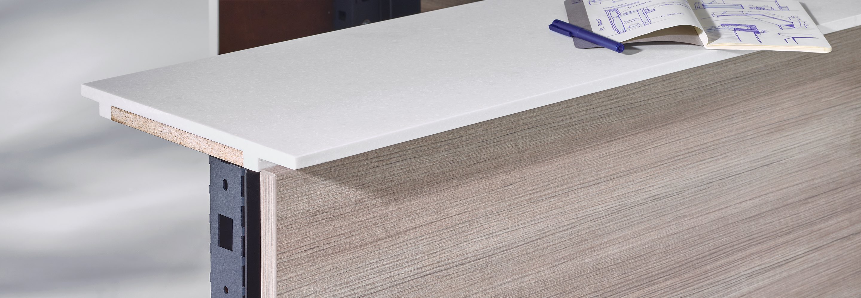 A close-up view of the Commend Nurse’s Station surface with a sketchbook and interior structure exposed. A close-up view of the Commend Nurse’s Station surface with a sketchbook and interior structure exposed.