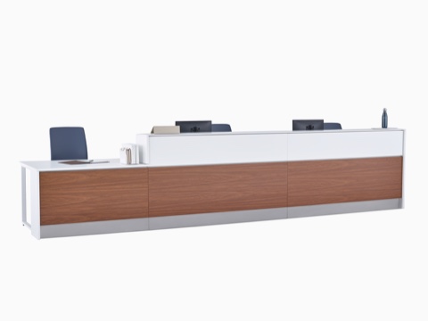 A Commend Nurses Station with white Corian tops, blue Verus Chairs, walnut woodgrain laminate, and stainless steel toe kicks. A Commend Nurses Station with white Corian tops, blue Verus Chairs, walnut woodgrain laminate, and stainless steel toe kicks.