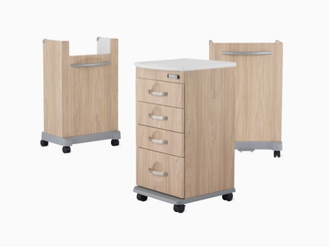 Compass casework carts, including a supply cart, a trash cart and a linen cart in a warm elm finish.