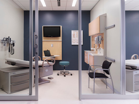Modular healthcare components from the Compass System provide storage and support technology in an exam room. 