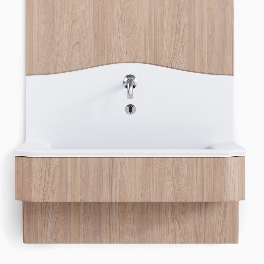 Compass casework ADA sink in a white solid surface with an elm wood sink apron and wall.