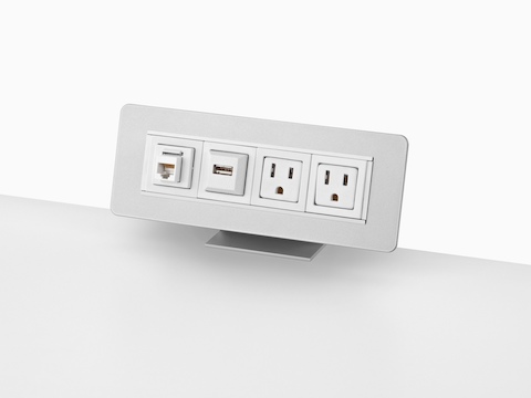 A surface-attached Connect power port with four connection points.