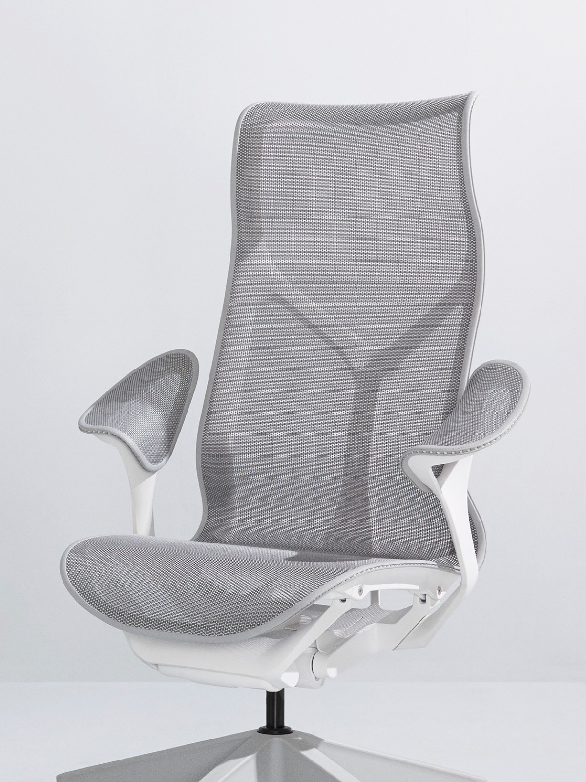 A Mineral grey high-back Cosm Chair with a white frame and leaf arms on a light grey background.