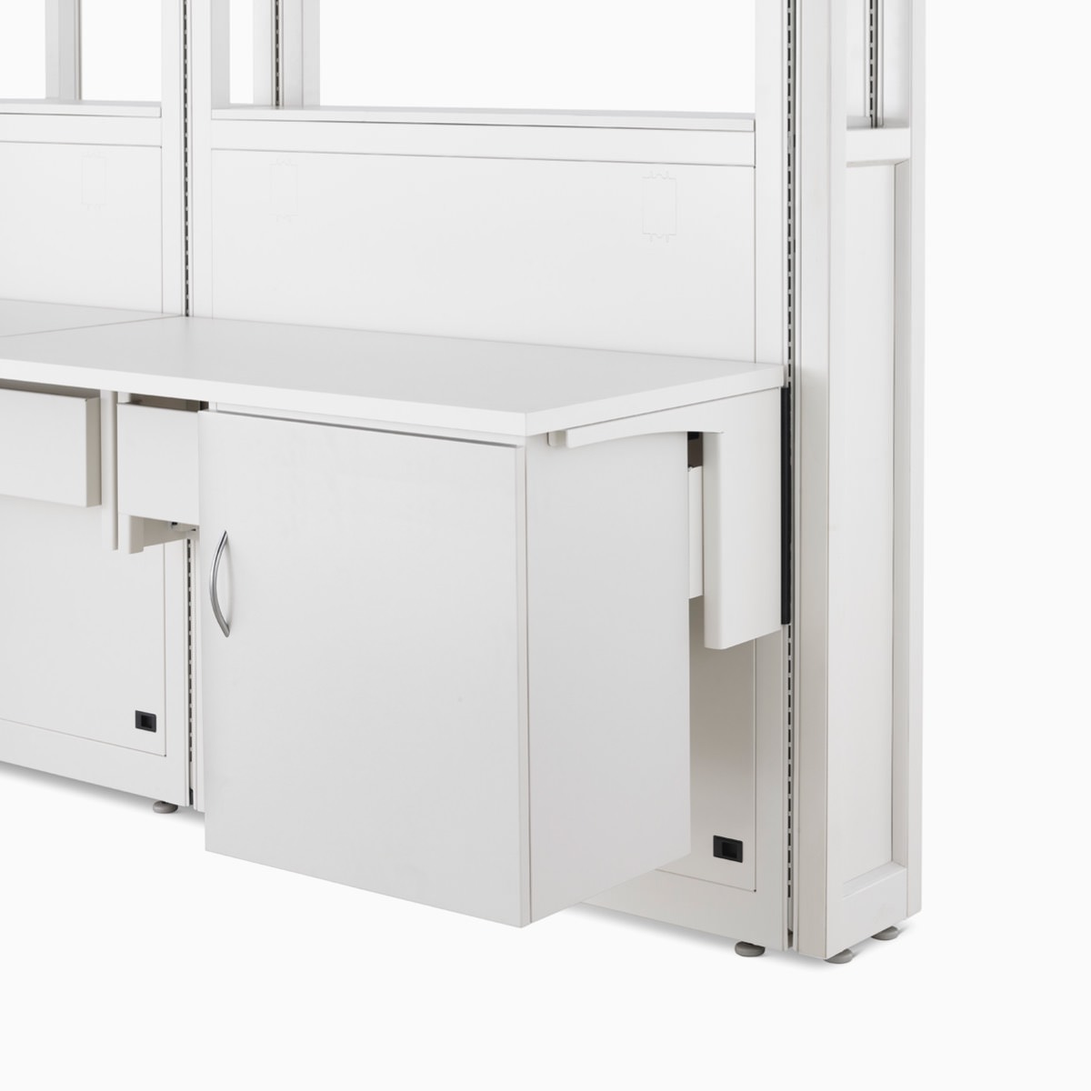 Detail of soft white Co/Struc System frame module, work surface, and storage unit hanging on an adapter rail under the surface.