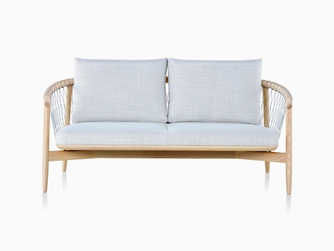 A light-colored Crosshatch Settee featuring gray upholstery and a white ash frame.