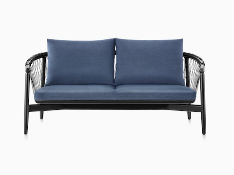 A dark colored Crosshatch Settee featuring navy upholstery and an ebony on ash frame.