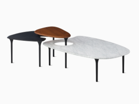 Tables Cyclade, gamme avec plateaux en ébène, noyer et marbre.